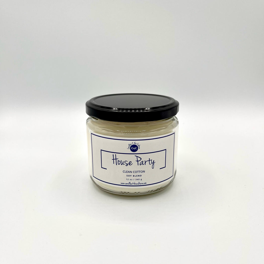 12 oz glass jar candle with cotton wicks and soy blend wax, designed to enhance self-care through feelings of pride and self-worth in the celebration of culture. White label with blue text reads 'House Party'. Fragrance evokes memories of clean cotton blowing in the breeze.